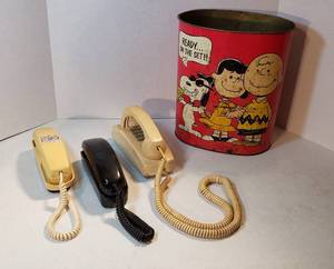 lot 235 image: Vintage Peanuts Metal Trash Can and 3 Push Button Landline Telephones