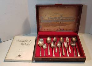 lot 247 image: 18 pcs. Mixed Patterns of Silverplated Silverware wwood Storage case  17 x 11.5 x 3.5 in. tall and Book of Silverplated Flatware
