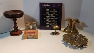 lot 248 image: Brass Decor Duck Bookends, 8 in. Trivet, and Bell (4.5 in. tall) Book on Collectibles Wood Turned Pedestal Stand 4 Horse Ceramic Coasters and Bi-fold Frame wHorse Pix