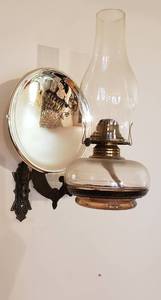 lot 269 image: Vintage Oil Lamp on Cast Iron Wall Sconce wMercury Glass reflective disc  8 x 11x 15 in. tall