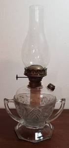 lot 284 image: Vintage Cut Press Clear Glass Double Handle Oil Lamp  16.5 in. tall