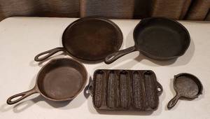 lot 301 image: 5 Cast Iron Cooking Pans Flat Skillet, 2 Small Skillets, Cornbread Mold and One Egg Skillet