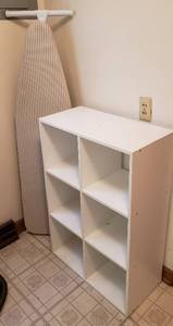lot 357 image: Particle Board 6 Cubby Organizer (24 x 12 x 36 in. tall) and Ironing Board