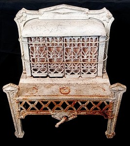 lot 306 image: Antique () Ornate Cast Iron Gas Heater - 18 W x 21 H x 8 D