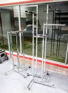 lot 424 image: Lot of 2 - 4 Way Straight Arms Adjustable Chrome Clothing Racks - Square Tubing - Perfect for Clothing Store Display (one is missing a caster)