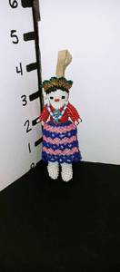 lot 1015 image: Hand beaded Native American girl statue