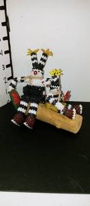 lot 1016 image: Hand beaded Native American family statues