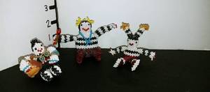 lot 1019 image: Hand beaded Native American family statues