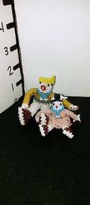 lot 1020 image: Hand beaded Native American family statue