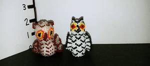 lot 1023 image: Hand beaded Native American owl statues