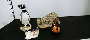 lot 1071 image: Tombo penguin with various penguin decor