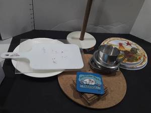 lot 1120 image: Miscellaneous kitchen items. Cutting boards stove top burner covers paper towel holder and etc...