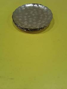 lot 1138 image: Set of 4 coasters. Round hammered gold finish