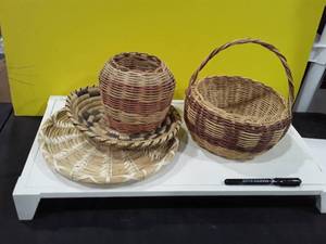 lot 1504 image: Wicker baskets lot of 4. One states its handmade by a Cherokee Woman. See pictures