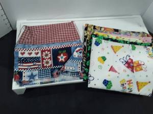 lot 1545 image: Interchangeable hot pot pads. 6 different themes and a cover for a toaster