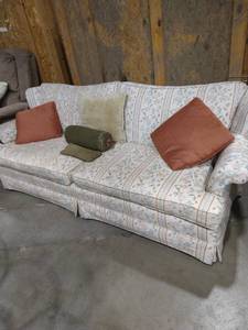 lot 2008 image: Rust, olive, blue patterned couch with assorted pillows
