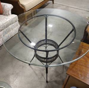 lot 2011 image: Black round bottom table 30 x 23 1 12 in. with beveled round glass top 36 in. 12 in. thick