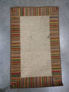 lot 2020 image: Red, green, tan rectangle area rug 35 x 21 12 in.