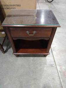 lot 2021 image: Young America brand Wooden night stand 25 12 x 23 in. with glass top 22 14 x 15 58 in.