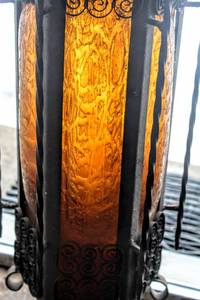 lot 19 image: Vintage Mid Century Wrought Iron and Crackle Hand Blown Amber Glass Swag Lamp 33 Tall