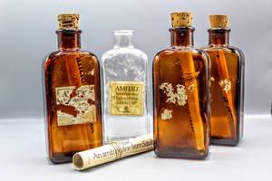 lot 1316 image: (4) 1978 Squibb Amitid Amitriptyline Tablets Bottles with Advertisement Message in the Bottles