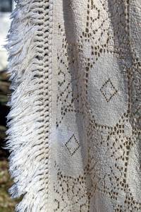 lot 1647 image: Vintage Boho Country Chic Woven Crochet with Edge Fringe Bedspread, Tablecloth, Throw 90 x 72 and (2) Lap Quilts