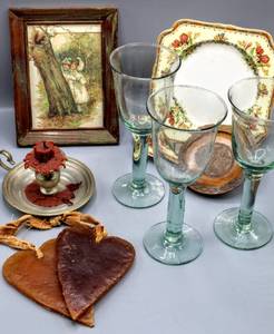 lot 1533 image: Assorted Lot of Hand Blown Artisan Wine Goblets, Artisan Heart Shaped Wax Decor, Pewter Candlestick Holder, Hand Painted Plates and more