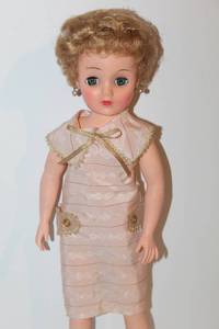 lot 1667 image: Vintage Jolly Doll The Doll of Distinction, Metal Doll Stroller, and 2 Stick Riding Horses