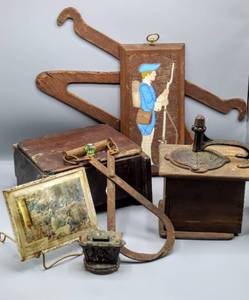 lot 1695 image: Vintage Retail Advertisement Plaque Thermometer, Antique 13 Primitive Iron Ice or Hay Tongs Hooks, Pat. May 15, 1838 Mill Grinder Box, Iron Coin Bank and more