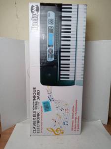 lot 110 image: Rockjam 54key Portable Digital Piano Keyboard Music Stand Interactive Lcd Screen Adapter included tested powers on