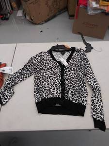 lot 29109 image: womens small sweater, has mark on front