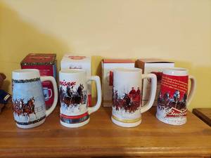 lot 7312 image: (4) Budweiser Holiday Steins - 2009, 2011, 2012, 2013