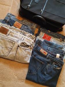 lot 7247 image: Denim jeans sizes 30x34, 29x32, womens size 3 w suitcase