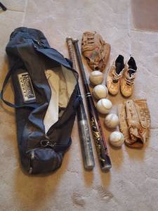 lot 7373 image: Softball equipment. Note 1 left & 1 right hand mitt