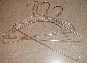 lot 5124 image: Lot of 4 thick Aluminum () Wire Hangers - High style