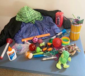 lot 5186 image: Teachers Desk Drawer Lot - Toys she took from the kids LOL and a nice Jacket