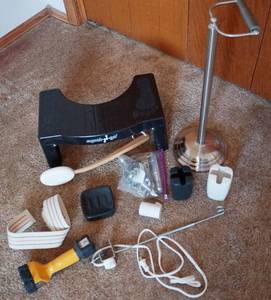 lot 5216 image: Portable Squatty Potty, TP Holders, Curling Iron Rack, Ceramic Toothbrush Holder, NEW bath sponge on a stick and more See pics