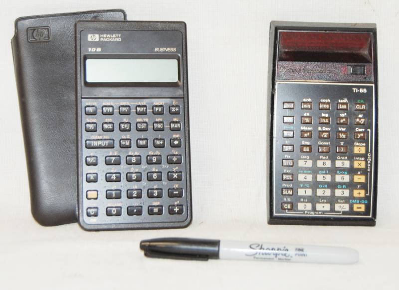 lot 96788 image: Lot of 2 Calculators, One With A Leather Case