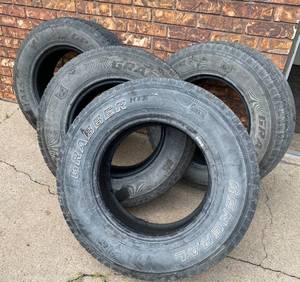 lot 99045 image: Set of 4 Grabber HTS Tires - 25570 R 17 - 115 S - see penny tread pics