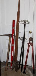 lot 8021 image: Heavy Duty Manual Post Hole Digger, (2) Electrical Conduit Benders, Large Vintage Pick Axe, Heavy Duty Clamp Pliers and 36 Steel Level
